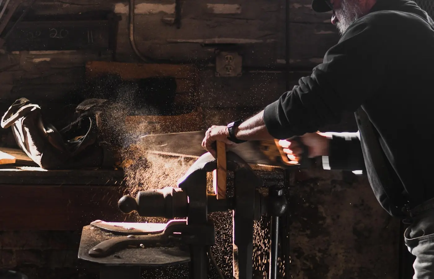 Carpenter working timber at a bench